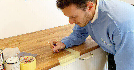 Bath Repair Birmingham - Bath Repair Birmingham technician performing professional bathtub restoration in a Moseley Victorian terrace using precision enamel repair techniques